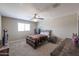 Comfortable bedroom features a bed, end tables, and carpet flooring at 9337 W Medlock Dr, Glendale, AZ 85305