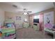 ' bedroom featuring carpeted floors, colorful decor, and a ceiling fan at 9337 W Medlock Dr, Glendale, AZ 85305