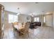 Open-concept dining and living room with tile flooring and ample natural light at 9337 W Medlock Dr, Glendale, AZ 85305
