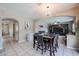 Dining area featuring a chandelier, seamlessly connected to the living room at 9337 W Medlock Dr, Glendale, AZ 85305