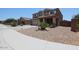 A charming two-story home featuring low-maintenance landscaping and an attached two-car garage at 9337 W Medlock Dr, Glendale, AZ 85305