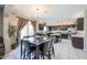 Spacious kitchen with dark wood cabinets, stainless steel appliances, and granite countertops at 9337 W Medlock Dr, Glendale, AZ 85305