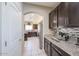 Modern kitchen includes granite countertops, stainless steel appliances, and ample cabinet space at 9337 W Medlock Dr, Glendale, AZ 85305