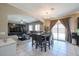 Open-concept living space with access to the backyard and seamless flow into the dining area at 9337 W Medlock Dr, Glendale, AZ 85305
