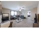 Comfortable living room features a gray sofa, coffee table, and large window at 9337 W Medlock Dr, Glendale, AZ 85305