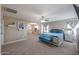 Expansive main bedroom features a sitting area, ensuite bathroom, and neutral decor at 9337 W Medlock Dr, Glendale, AZ 85305