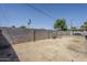 Spacious backyard featuring a block wall, dirt landscaping, and a covered patio area at 1066 E 7Th Pl, Mesa, AZ 85203