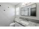 Chic bathroom featuring a granite countertop, modern fixtures, and a stylish framed mirror at 1066 E 7Th Pl, Mesa, AZ 85203