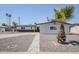 Charming single-story home featuring desert landscaping and solar panels on the roof at 1066 E 7Th Pl, Mesa, AZ 85203