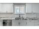 Kitchen features stainless steel dishwasher, undermount sink, and granite countertops at 1066 E 7Th Pl, Mesa, AZ 85203