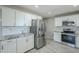 Bright kitchen with stainless steel refrigerator and modern appliances at 1066 E 7Th Pl, Mesa, AZ 85203