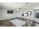 Open-concept living room with hardwood floors and seamless kitchen access at 1066 E 7Th Pl, Mesa, AZ 85203