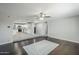 Open living space with wood-look floors flowing into an adjacent kitchen, offering a modern, airy feel at 1066 E 7Th Pl, Mesa, AZ 85203