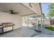 Covered patio with outdoor grill, fan, and furniture creating a relaxing outdoor living space at 1066 E 7Th Pl, Mesa, AZ 85203