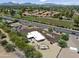 Overhead view of a desert landscaped home featuring an outdoor seating area and a fenced pool, located near a road at 11041 N Hayden Rd, Scottsdale, AZ 85260