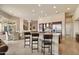 Gourmet kitchen with a breakfast bar that seamlessly integrates into the dining area and nearby patio at 11448 E Blue Sky Dr, Scottsdale, AZ 85262