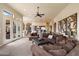 Open living area showcases neutral decor with seamless flow to the kitchen and backyard access at 11448 E Blue Sky Dr, Scottsdale, AZ 85262