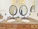 Bathroom with dual sinks, granite countertop, and wood cabinets at 12770 W Alvarado Rd, Avondale, AZ 85392
