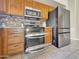 Close-up of a modern kitchen showcasing stainless steel appliances and granite countertops at 12770 W Alvarado Rd, Avondale, AZ 85392