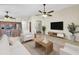 Inviting living space with an open layout, tile floors, and a view of the kitchen area at 12770 W Alvarado Rd, Avondale, AZ 85392