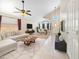 Open-concept living area with vaulted ceilings, tile flooring, and contemporary decor at 12770 W Alvarado Rd, Avondale, AZ 85392