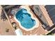 Aerial view of a private backyard pool surrounded by desert landscaping at 12770 W Alvarado Rd, Avondale, AZ 85392