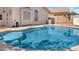 Private backyard pool offers a serene escape with cool, clear water at 12770 W Alvarado Rd, Avondale, AZ 85392