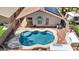 Backyard pool with custom stonework and patio at 12770 W Alvarado Rd, Avondale, AZ 85392