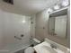 Neutral bathroom featuring tiled shower and tub combo, vanity and mirror at 131 N Higley Rd # 215, Mesa, AZ 85205