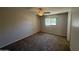 Bedroom featuring neutral walls and carpet plus a window at 131 N Higley Rd # 215, Mesa, AZ 85205