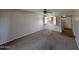 Spacious living room featuring neutral walls and carpet at 131 N Higley Rd # 215, Mesa, AZ 85205