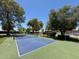 Community pickleball court with green and blue surface and a blue net at 131 N Higley Rd # 215, Mesa, AZ 85205