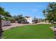 Spacious backyard features a well-maintained lawn, desert landscaping and access to a covered patio and pool at 1454 E Calle De Arcos --, Tempe, AZ 85284
