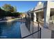 Backyard pool with diving board, safety fence and covered patio. Perfect for outdoor enjoyment and relaxation at 1454 E Calle De Arcos --, Tempe, AZ 85284