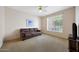 Simple bedroom with a ceiling fan and window, offering a serene and comfortable space at 1454 E Calle De Arcos --, Tempe, AZ 85284
