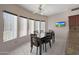 Bright dining area with plenty of natural light, ceiling fan, and a tv at 1454 E Calle De Arcos --, Tempe, AZ 85284