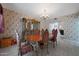 Traditional dining room with a decorative hutch, ornate table, chairs, and a chandelier at 1454 E Calle De Arcos --, Tempe, AZ 85284
