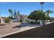 Beautiful home with desert landscaping and a curved driveway, showcasing a serene and inviting atmosphere at 1454 E Calle De Arcos --, Tempe, AZ 85284