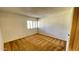 Sunlit bedroom showcasing a window with plantation shutters at 1550 N Stapley Dr # 95, Mesa, AZ 85203