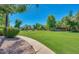 This lovely common area features mature shade trees and lush landscaping at 1550 N Stapley Dr # 95, Mesa, AZ 85203