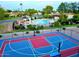 Aerial view showcasing the community pool, sport court, and well-maintained landscaping at 1550 N Stapley Dr # 95, Mesa, AZ 85203