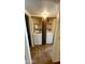 This laundry room features a full-size washer and dryer, shelving and neutral decor at 1550 N Stapley Dr # 95, Mesa, AZ 85203