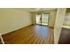 Bright living room with a sliding glass door and wood flooring at 1550 N Stapley Dr # 95, Mesa, AZ 85203