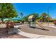 This community playground features a play structure, benches, and mature trees at 1550 N Stapley Dr # 95, Mesa, AZ 85203