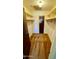 This carpeted walk-in closet has ample shelving and a center light at 1550 N Stapley Dr # 95, Mesa, AZ 85203