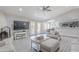 Bright living room with vaulted ceiling and fireplace open to kitchen/dining. Neutral palette throughout at 17634 N 34Th Ln, Phoenix, AZ 85053