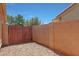 Gravel backyard featuring a fenced perimeter and clear skies above, providing privacy at 18130 N 92Nd Ln, Peoria, AZ 85382