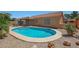 Inviting backyard pool surrounded by desert landscaping, offering a refreshing oasis for relaxation and enjoyment at 18130 N 92Nd Ln, Peoria, AZ 85382