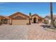 Welcoming single-story home with desert landscaping, tile roof, and a two car garage at 18130 N 92Nd Ln, Peoria, AZ 85382