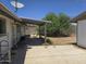 Backyard featuring a patio area and an adjacent grass area with picnic table at 1843 S Papago Dr, Apache Junction, AZ 85120
